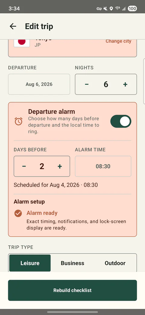 PackCue trip editor showing a departure alarm scheduled two days before travel and an Alarm ready state